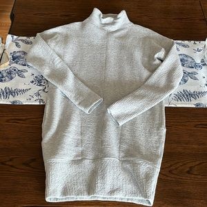 Lululemon dress. Loose turtleneck, with dropped shoulders.